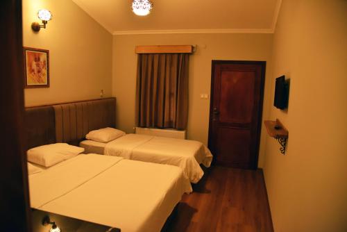 Postel nebo postele na pokoji v ubytování Fener Motel