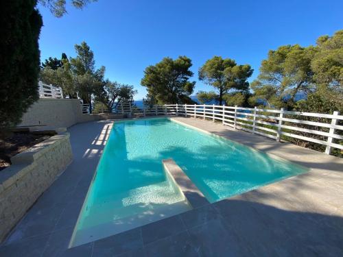 a swimming pool with a fence around it at Mercure Argentario Hotel Filippo II in Porto Santo Stefano