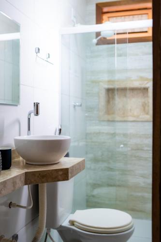 a bathroom with a sink and a toilet at Acoara Beco Doce in Jericoacoara