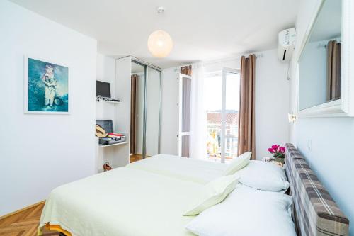 Ένα ή περισσότερα κρεβάτια σε δωμάτιο στο Jele Rooms