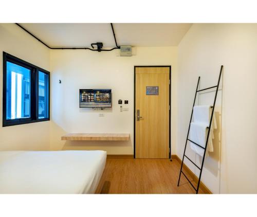 Ein Bett oder Betten in einem Zimmer der Unterkunft Siam Subway Hostel and Café