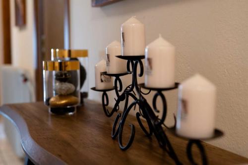 a group of candles sitting on top of a table at Olympus View Rooms Sauna & Spa in Litochoro