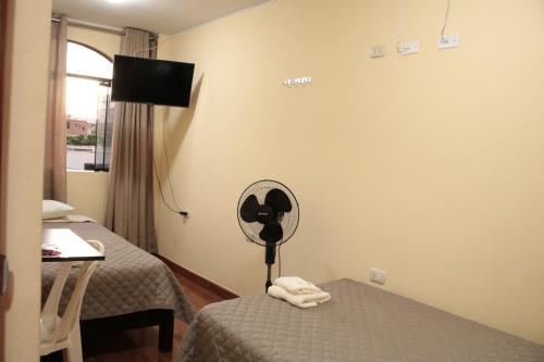 Postel nebo postele na pokoji v ubytování Hospedaje turístico Peruvian Wasi