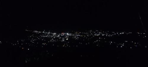 a view of a city lit up at night at Salora Kodai in Kodaikānāl