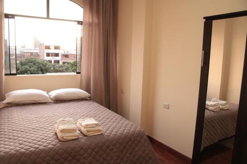 Posteľ alebo postele v izbe v ubytovaní Hospedaje turístico Peruvian Wasi