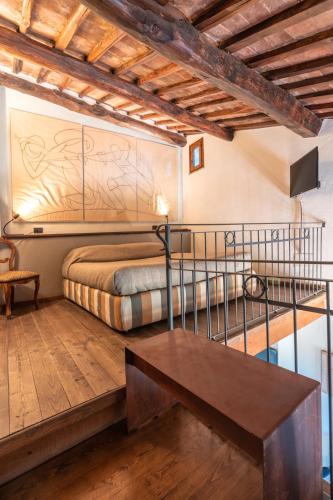 Una cama o camas en una habitación de Hotel Della Fortezza