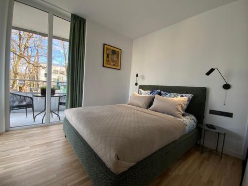Posteľ alebo postele v izbe v ubytovaní Alėjos Apartmentai Comfort