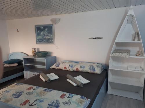 Postel nebo postele na pokoji v ubytování La Doi Pasi De Mare