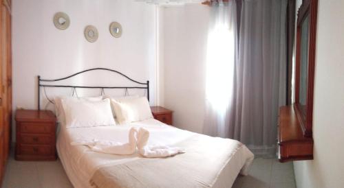 Postel nebo postele na pokoji v ubytování Apartamento ohana