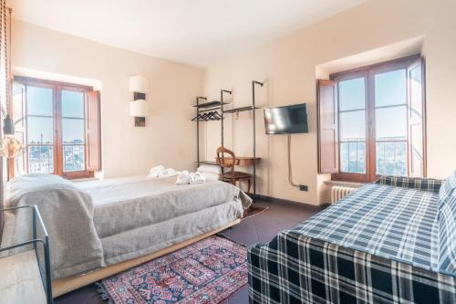 Una cama o camas en una habitación de Hotel Della Fortezza