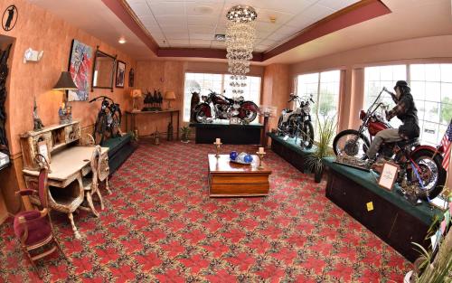 a living room with motorcycles parked in a room at Prospector Hotel & Casino in Ely