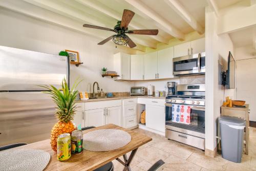 a kitchen with a table and a ceiling fan at NEW - Pineapple Loft - Entire House Downtown Hilo with AC in Hilo