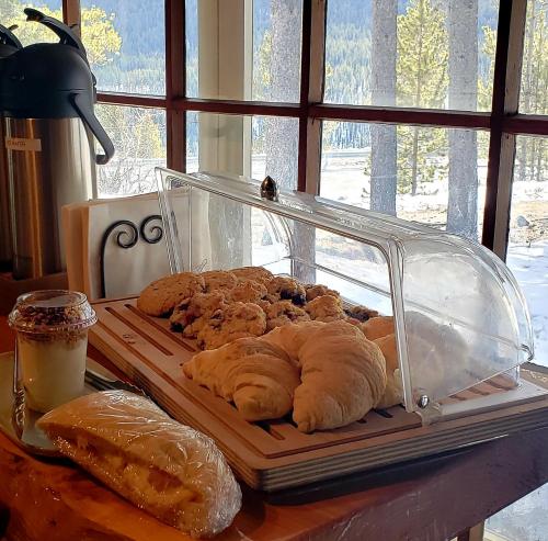 a plate of pastries sitting on a table at Storm Mountain Lodge & Cabins in Banff