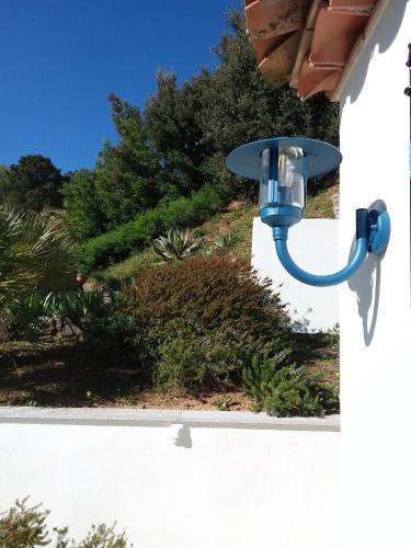 a blue light on the side of a building at Luciana in La Croix-Valmer