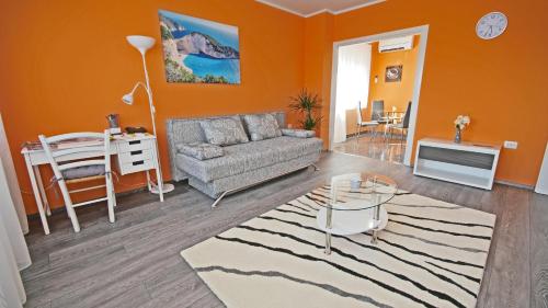 a living room with a couch and a table at Apartment RINO****, 58m², 170m from the beach in Rijeka