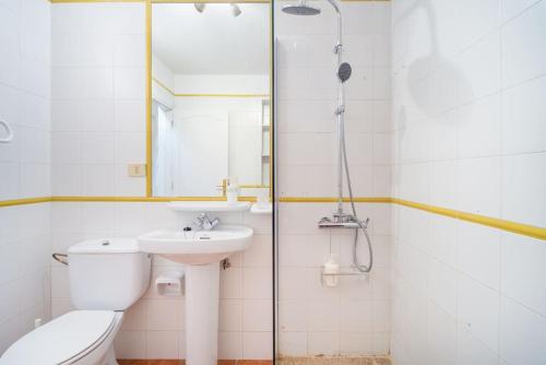 a bathroom with a toilet and a sink and a shower at FABULOUS BUNGALOW , WIFI, SWIMMING POOL AND BEACH in Pasito Blanco