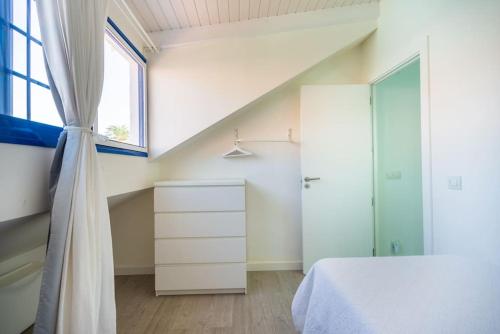 a bedroom with a bed and a window at FABULOUS BUNGALOW , WIFI, SWIMMING POOL AND BEACH in Pasito Blanco
