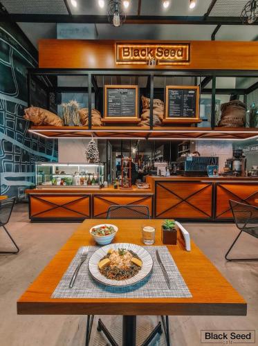 a table with a plate of food on top of it at Three O Nine Hotel in Beirut