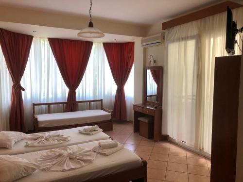 A bed or beds in a room at Panos Studios