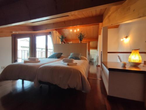 A bed or beds in a room at Allotjaments Paratge Fabas