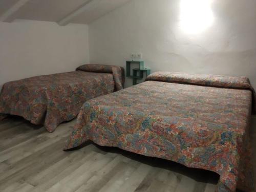 A bed or beds in a room at Rincón de Marco y María