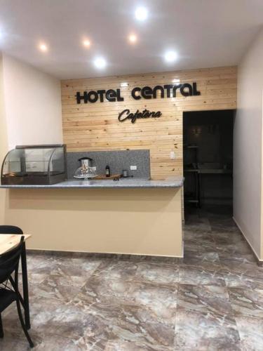 a hotel terminal with a sign on the wall at HOTEL CENTRAL in El Tambo
