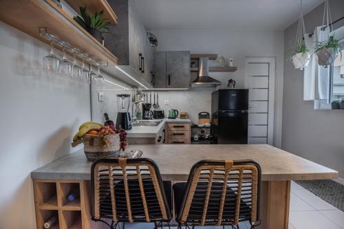 a kitchen with a large wooden table and chairs at Inconceptual apartment in Paradeísion