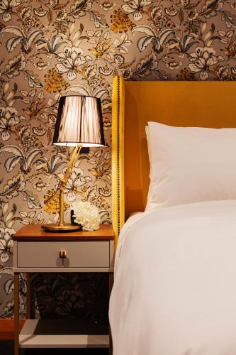 Кровать или кровати в номере Wigram Hotel
