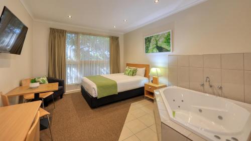 Ένα ή περισσότερα κρεβάτια σε δωμάτιο στο Quality Inn Swan Hill