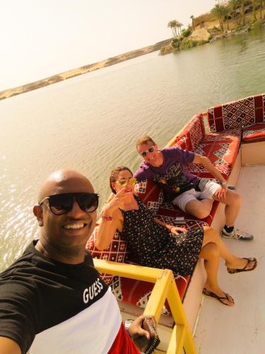 a group of people sitting on a boat in the water at Safari Abu Simbel in Abu Simbel
