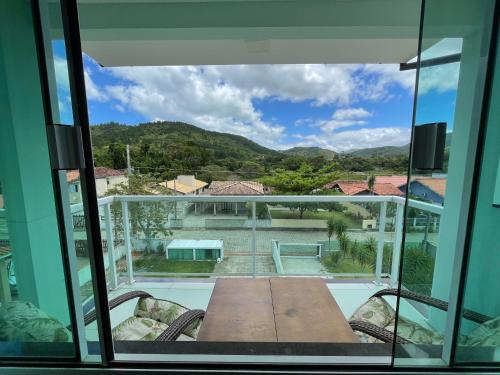 a view from the window of a house at Ipê Palmas Hostel in Governador Celso Ramos