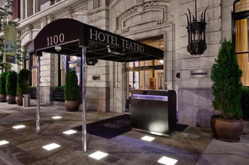 a hotel sign in front of a building at Hotel Teatro in Denver