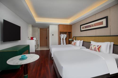 Ένα ή περισσότερα κρεβάτια σε δωμάτιο στο Wingate By Wyndham Yangshuo