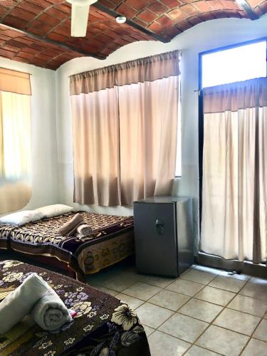Cama o camas de una habitación en Posada Las Graditas