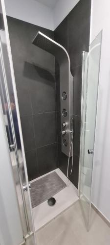 a shower with a glass door in a bathroom at LA NUOVA HERA in Crotone