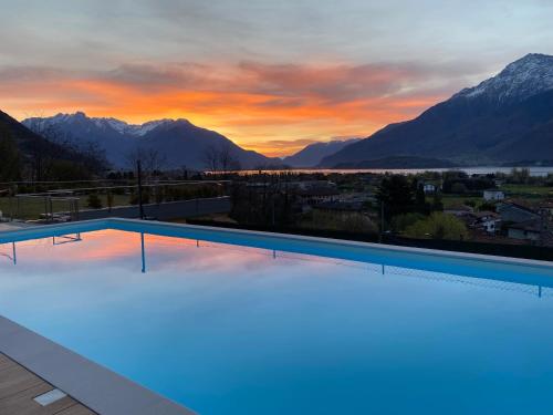 a swimming pool with a view of the mountains at BELLA VITA Residence in Gravedona