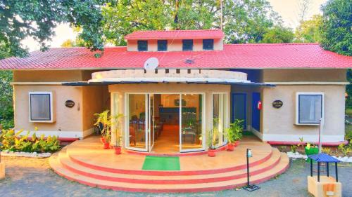 a model of a house with a large front yard at Bundela Bandhavgarh by Octave in Mānpur