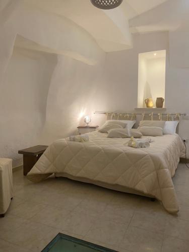 a bedroom with a large bed in a room at SALENTO NONNI in Matino