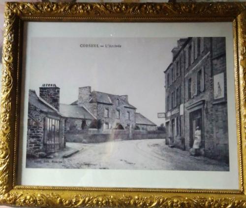 a black and white photo of a street with buildings at La Ménardière Serenitatis chambre d'hôtes petit déjeuner compris in Corseul