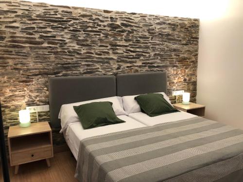 Ένα ή περισσότερα κρεβάτια σε δωμάτιο στο APARTAMENTOS ARMANYA 3