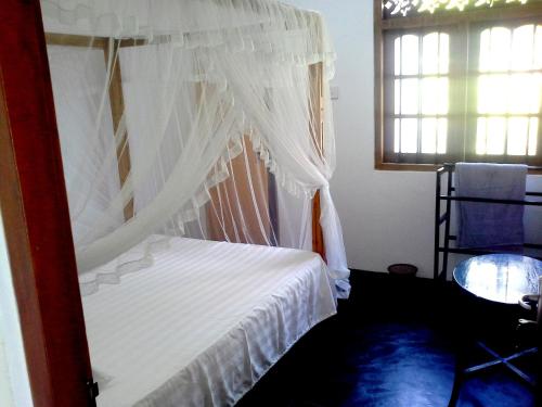 Cama o camas de una habitación en Sunstyle Mirissa Guest House