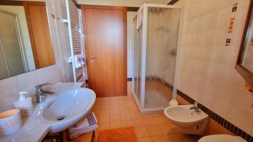 a bathroom with a sink and a shower and a toilet at Villa Venezia in Mira