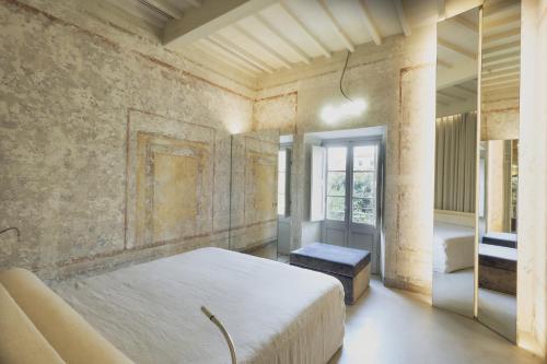 Postel nebo postele na pokoji v ubytování SUGAR ROOMS Residenza d'Epoca