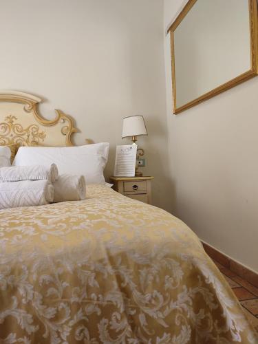 a bedroom with a bed with a teddy bear on it at Casa Aurora in Ravenna