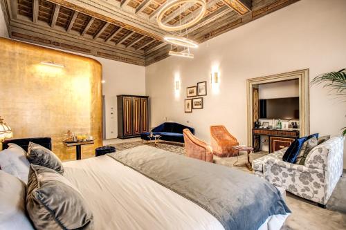 a bedroom with a bed and a living room at Martius Private Suites Hotel in Rome