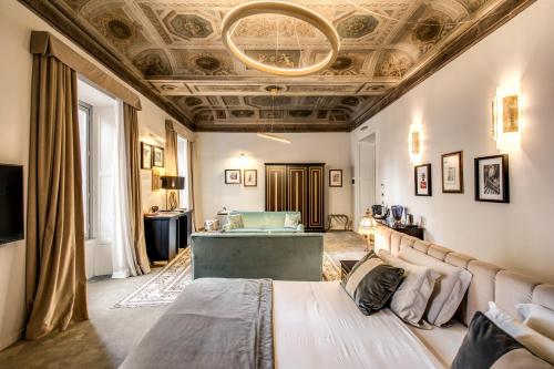 a living room with a couch and a ceiling at Martius Private Suites Hotel in Rome