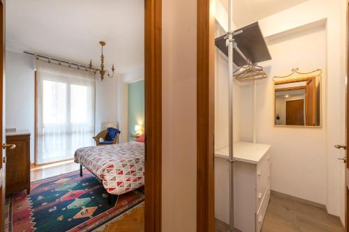 a bedroom with a bed and a window and a door at Il Nido del Belocchio in Perugia