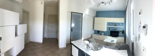 a large bathroom with a sink and a counter at Casa Vacanze Sunflower in Carrara
