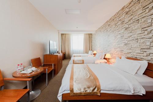 Postel nebo postele na pokoji v ubytování Springs Hotel Ulaanbaatar