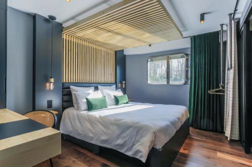 Postel nebo postele na pokoji v ubytování Savy Hôtel